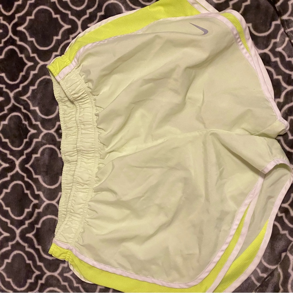 Neon green shorts, has shorts in it, stings so u can tighten it